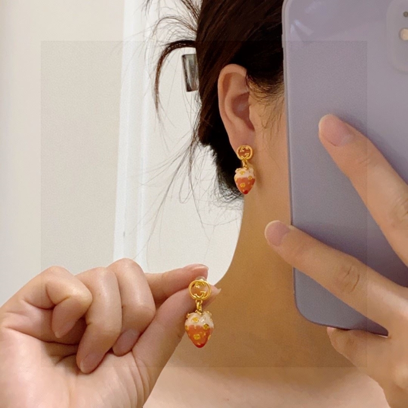 G*u*i earrings